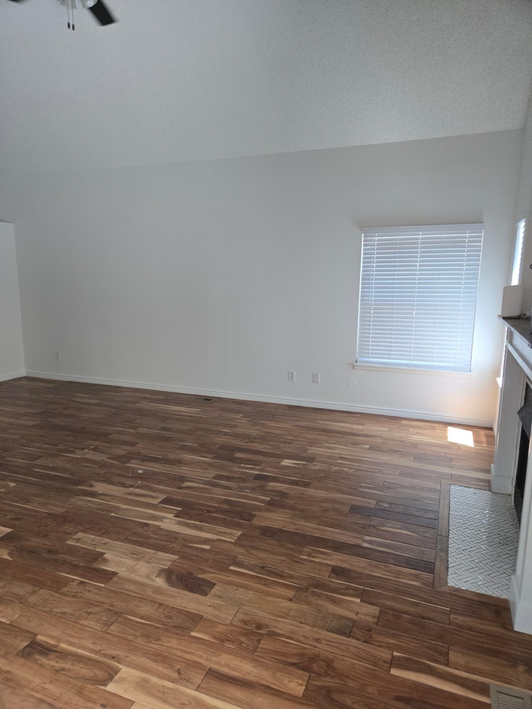 Empty room with hardwood floor after a cleanout
